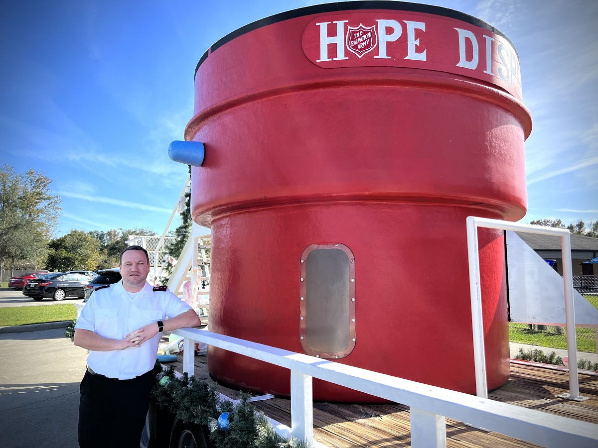 Salvation Army Lakeland Capt. Jeremy Mockabee with the largest red kettle in the United States.