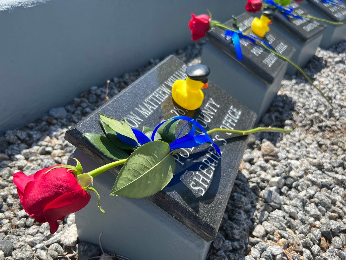 Family members also placed rubber ducks with law enforcement hats on the markers of Vernon "Matt" Williams and Larry Willis Rhoden, both Polk County Sheriff's deputies.