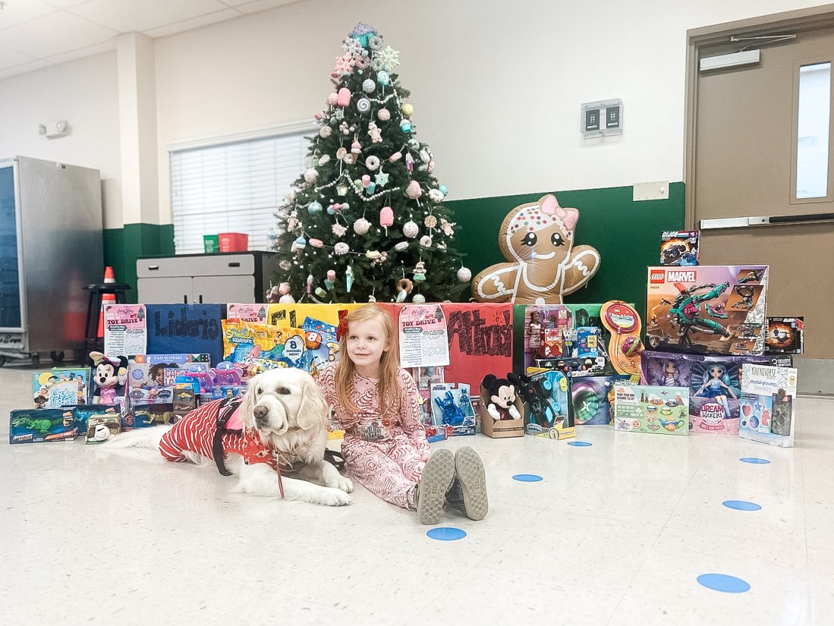 Kate, her service dog Glitz and gifts